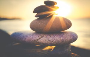 balancing stones on the beach